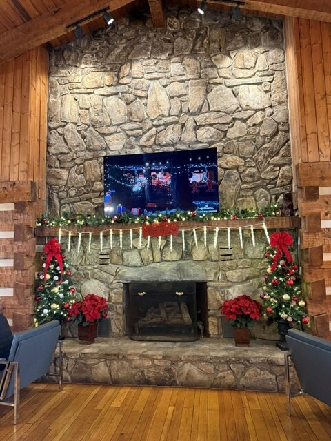a fireplace with lights and decorations