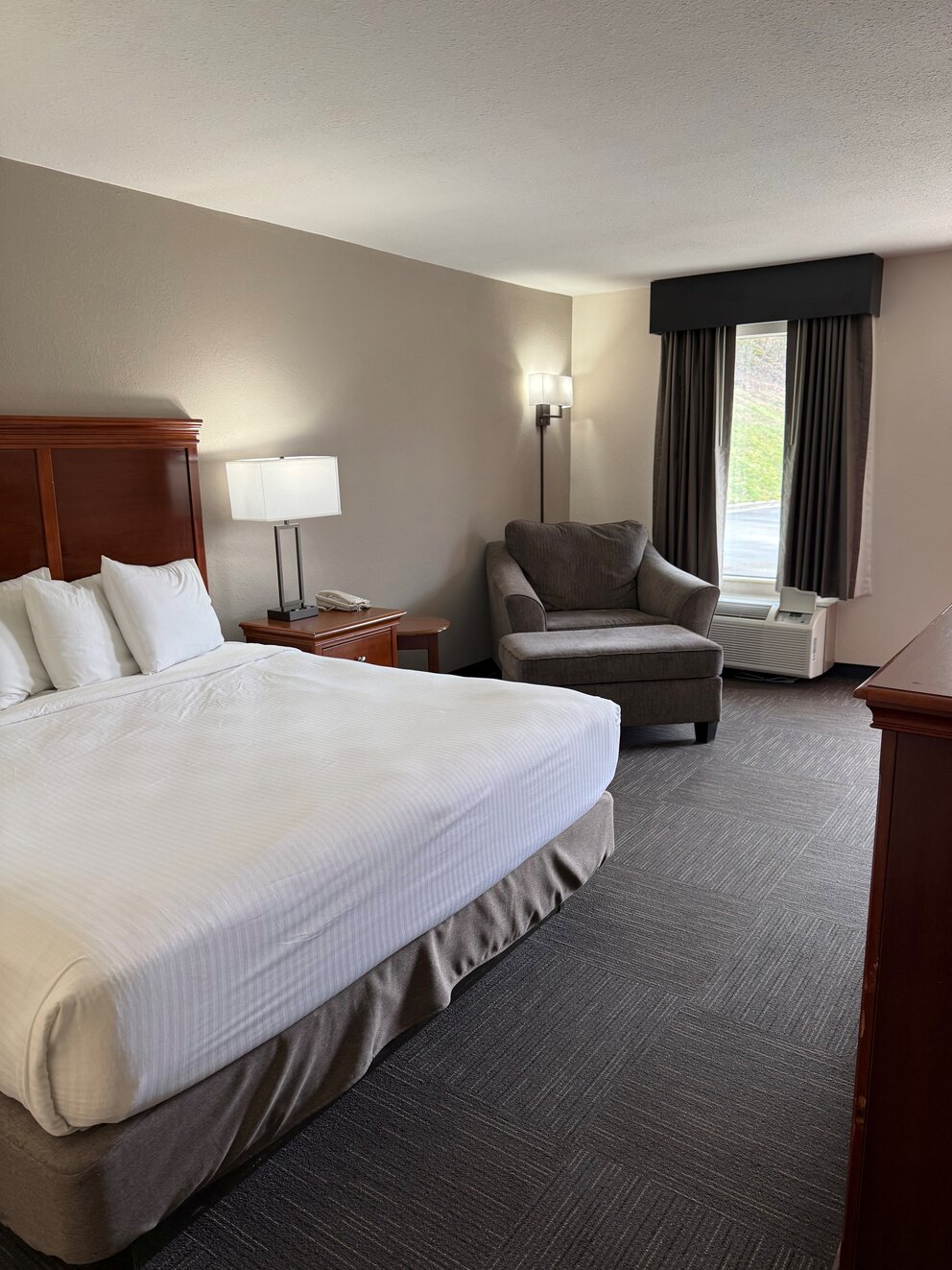 a room with a bed and a chair