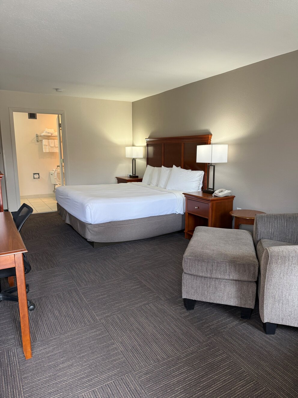 a room with a bed and a desk